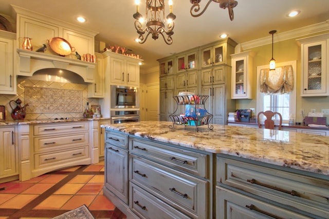 kitchen featuring ornamental molding, gray cabinets, light tile patterned flooring, and backsplash