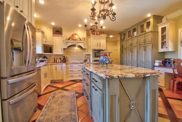 kitchen featuring light tile patterned floors, a kitchen island, appliances with stainless steel finishes, backsplash, and recessed lighting