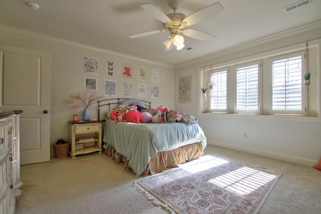 bedroom with light carpet, baseboards, visible vents, and ornamental molding