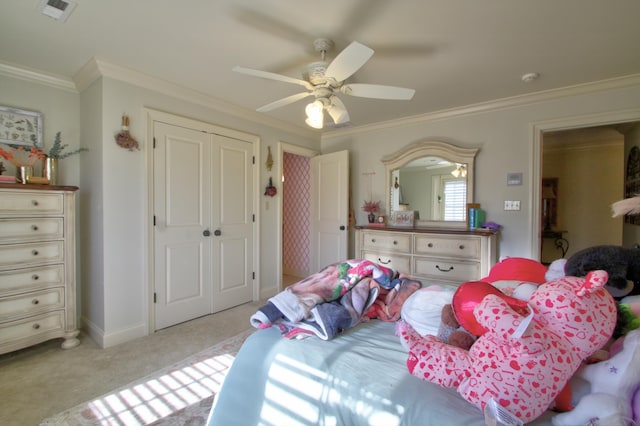 bedroom with light colored carpet, a ceiling fan, visible vents, ornamental molding, and a closet