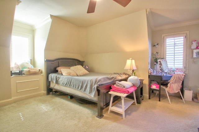 carpeted bedroom with crown molding and ceiling fan