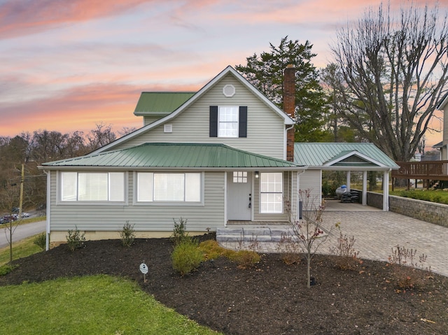 view of front of property with a carport