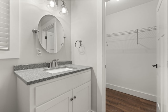 bathroom featuring hardwood / wood-style floors and vanity