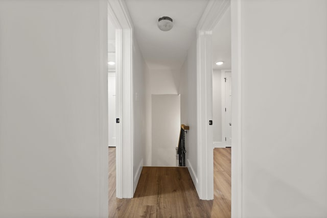 hall with light hardwood / wood-style flooring