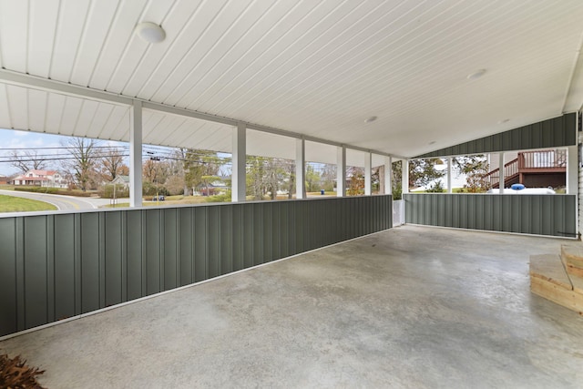 unfurnished sunroom featuring lofted ceiling