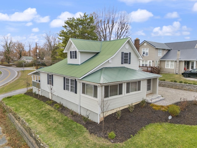 view of side of property with a yard