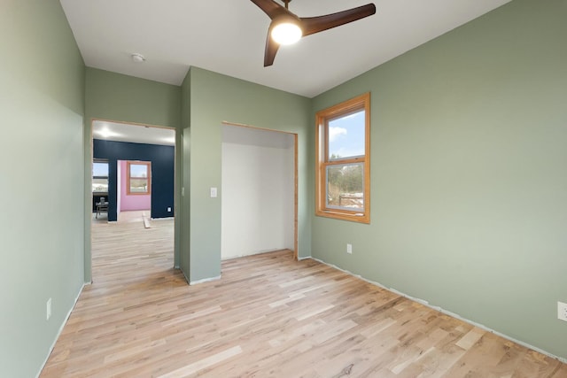 330 Duncan St, Somerset, KY 42501 - unfurnished bedroom with light wood-type flooring, multiple windows, and a closet