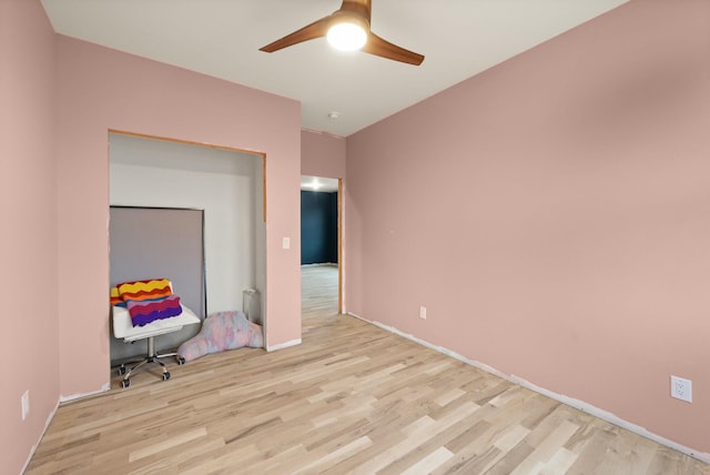 interior space featuring light wood-type flooring and ceiling fan