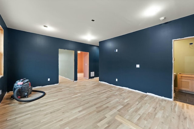 unfurnished room with light hardwood / wood-style floors