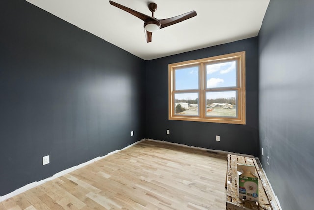 unfurnished room featuring ceiling fan and light hardwood / wood-style flooring