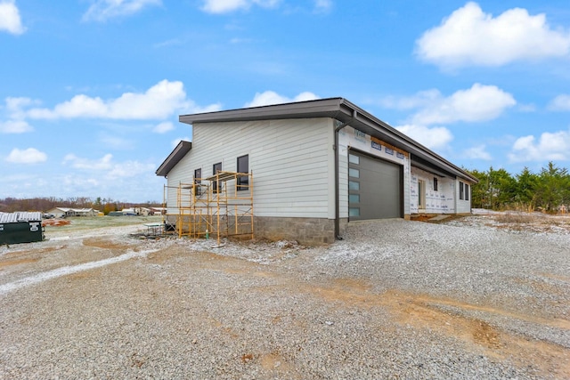 view of property exterior featuring a garage