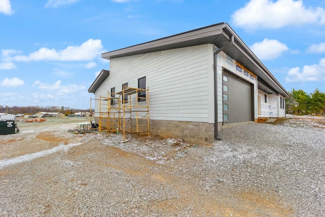 view of property exterior featuring a garage