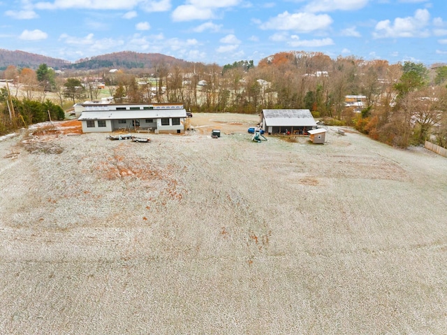 birds eye view of property featuring a mountain view