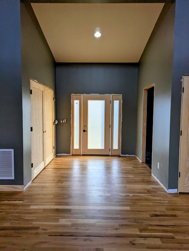 330 Duncan St, Somerset, KY 42501 - entryway with visible vents, a towering ceiling, and wood finished floors