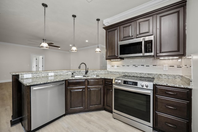 kitchen featuring ceiling fan, sink, stainless steel appliances, kitchen peninsula, and dark brown cabinets