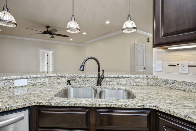 kitchen featuring ceiling fan, sink, backsplash, crown molding, and dark brown cabinets