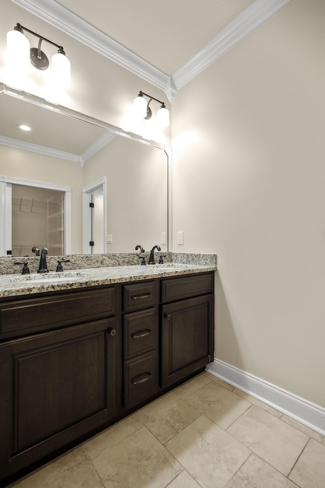 bathroom featuring vanity and crown molding