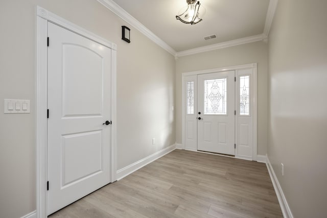 entryway featuring light hardwood / wood-style flooring and ornamental molding