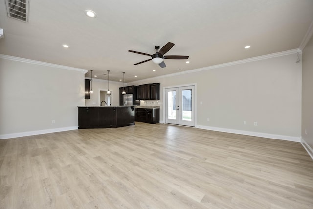 unfurnished living room featuring french doors, light hardwood / wood-style floors, ceiling fan, and ornamental molding