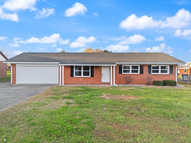 ranch-style house with a garage and a front yard