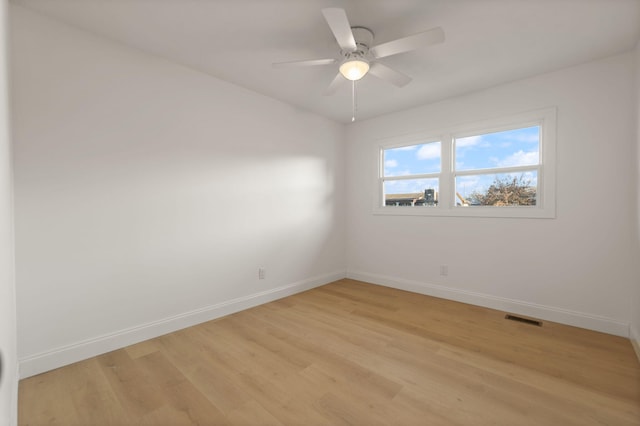 unfurnished room with ceiling fan and light hardwood / wood-style flooring