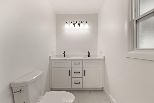 bathroom with vanity and toilet