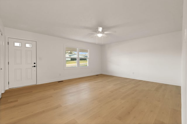 entryway with ceiling fan and light hardwood / wood-style flooring