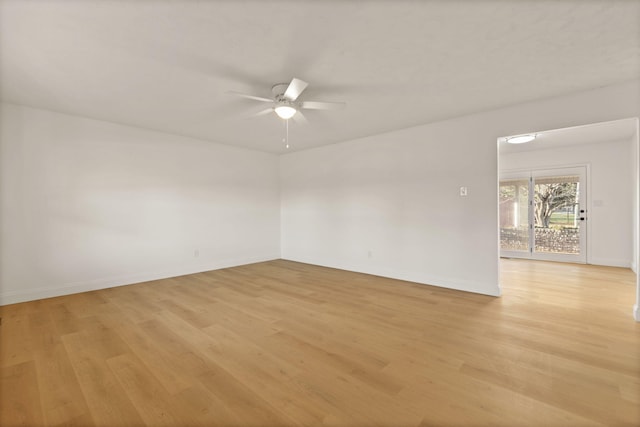 unfurnished room with ceiling fan and light wood-type flooring