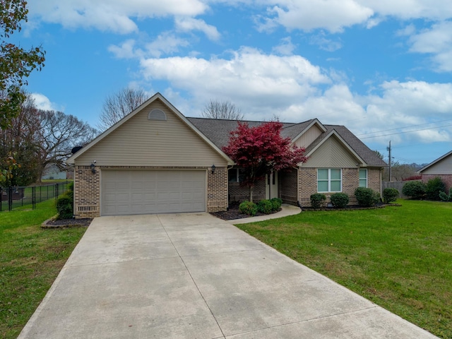 view of front of property with a front lawn and a garage