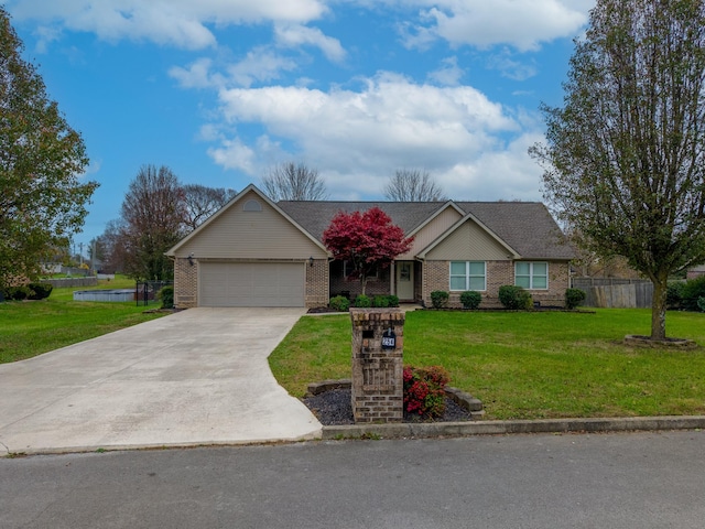 ranch-style house featuring a garage and a front lawn