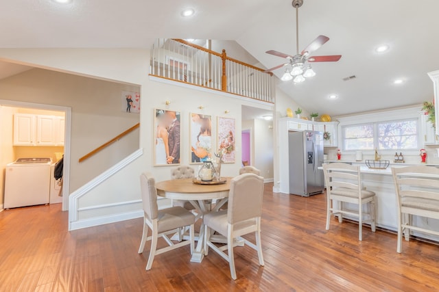 dining area featuring ceiling fan, light hardwood / wood-style floors, and high vaulted ceiling