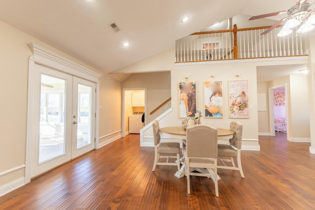 dining space with ceiling fan, dark hardwood / wood-style flooring, high vaulted ceiling, and french doors