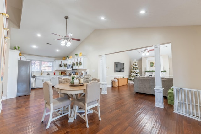 dining area featuring ornate columns, ceiling fan, dark hardwood / wood-style flooring, and high vaulted ceiling