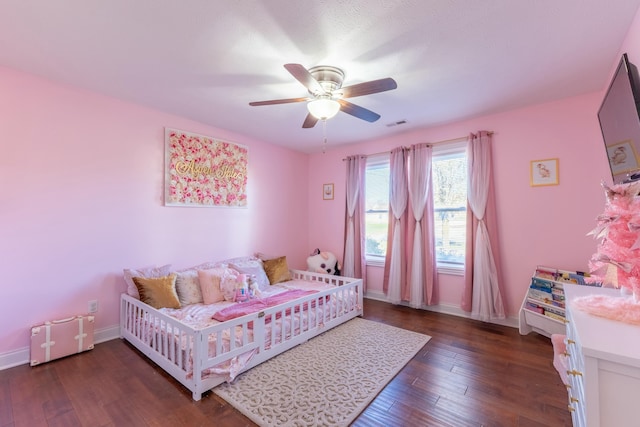 bedroom featuring ceiling fan and dark hardwood / wood-style flooring