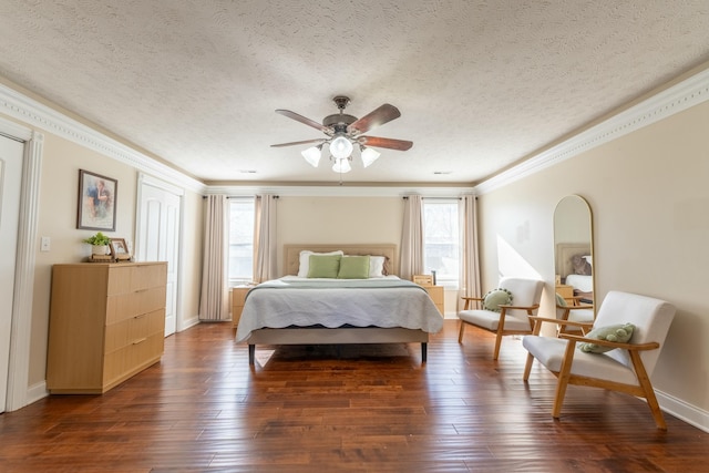 bedroom featuring dark hardwood / wood-style floors, ceiling fan, and multiple windows