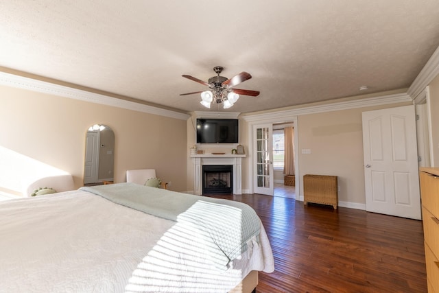 bedroom with a textured ceiling, ceiling fan, dark hardwood / wood-style flooring, and crown molding