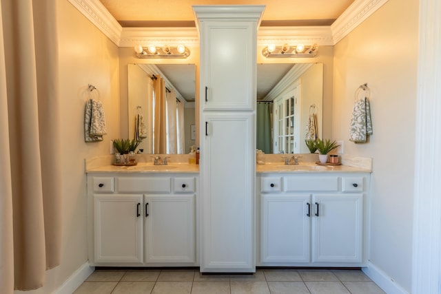 bathroom featuring tile patterned flooring, vanity, and ornamental molding