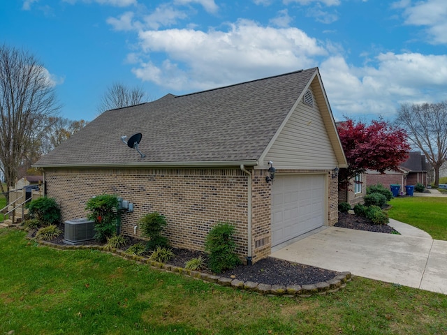 view of home's exterior with a garage, central air condition unit, and a yard