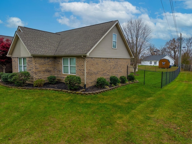 view of side of property featuring a yard