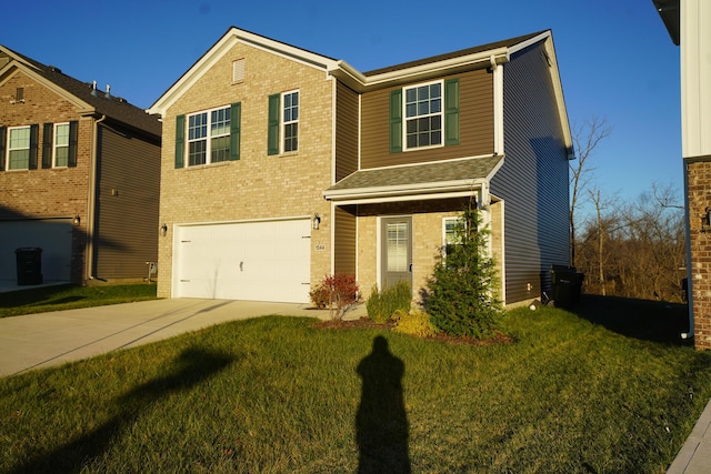 view of front facade featuring a front yard and a garage