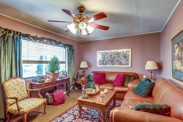 living room with ornamental molding and ceiling fan