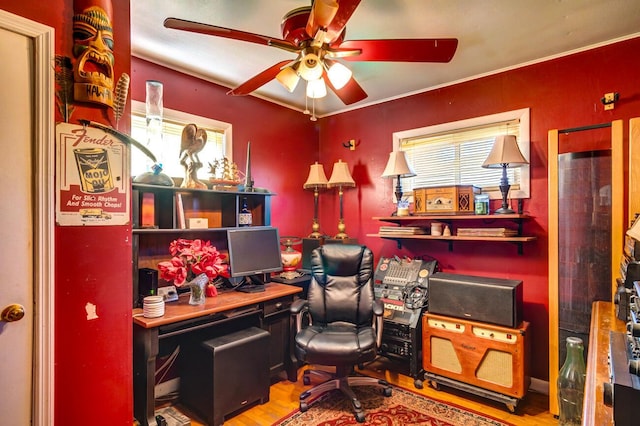 home office with hardwood / wood-style flooring and ceiling fan