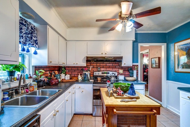 kitchen featuring light tile patterned flooring, white cabinetry, sink, ornamental molding, and electric range