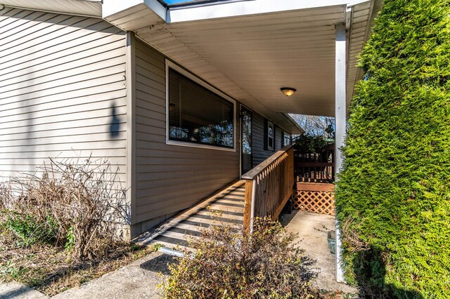 view of front facade with a front yard, a shed, and a deck