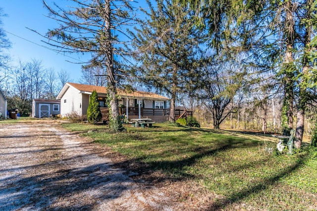 exterior space with covered porch and a front yard