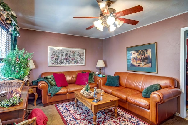 living room featuring crown molding and ceiling fan