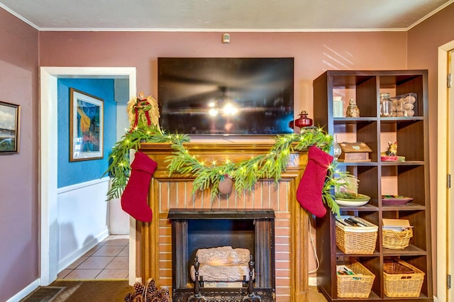 tiled living room with crown molding and a fireplace