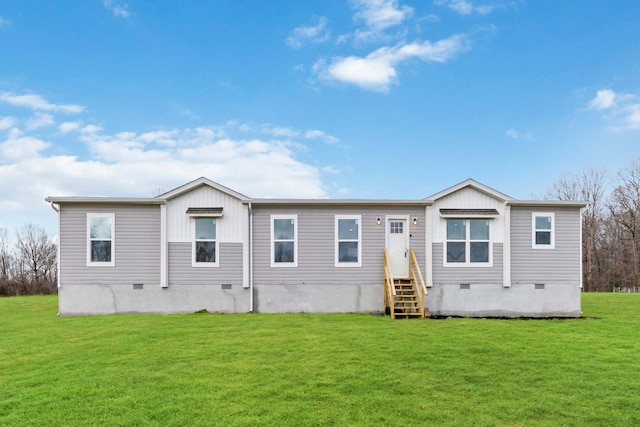 rear view of property with a yard