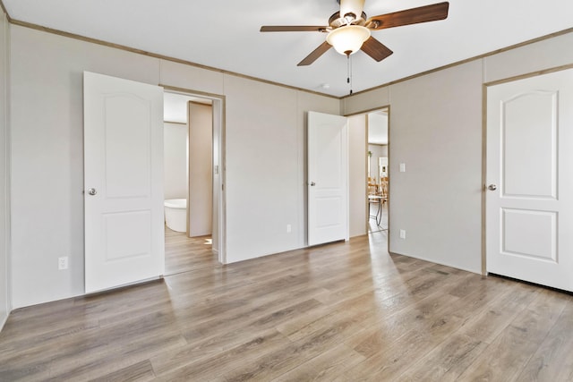 unfurnished bedroom with ornamental molding, ensuite bath, ceiling fan, and light hardwood / wood-style flooring