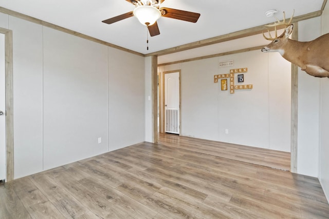 empty room featuring ceiling fan and light hardwood / wood-style floors